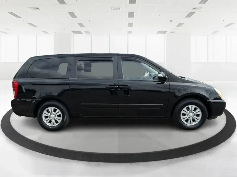 2012 Kia Sedona LX (KNDMG4C78C6) with an 3.5L V-6 DOHC engine, 5-Speed Automatic transmission, located at 401 Woodman Dr, Riverside, OH, 45431, (937) 908-9800, 39.760899, -84.123421 - Picture the next family road trip, soccer Saturday, or airport pickup where everyone actually fits comfortably-plus there's room left for groceries, strollers, and weekend gear. This 2012 Kia Sedona LX in Aurora Black is built for real life: school drop-offs, long commutes across the Miami Valley, a - Photo#1