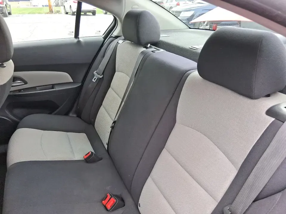 2015 Chevrolet Cruze LS Auto (1G1PA5SG9F7) with an ECOTEC 1.8L I-4 DOHC engine, 6-Speed Automatic transmission, located at 8750 N County Rd 25A, Piqua, OH, 45356, (937) 908-9800, 40.164391, -84.232513 - Picture an easy, affordable daily commute that still feels comfortable on I75, quick trips to downtown Piqua for dinner, and weekend errands that don't drain your budget at the pump. This 2015 Chevrolet Cruze LS Auto in eye-catching Red Hot is a smart, practical sedan for commuters, first-time buyer - Photo#10