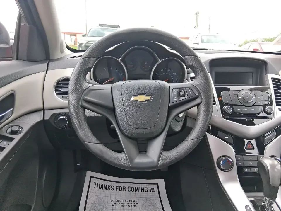 2015 Chevrolet Cruze LS Auto (1G1PA5SG9F7) with an ECOTEC 1.8L I-4 DOHC engine, 6-Speed Automatic transmission, located at 8750 N County Rd 25A, Piqua, OH, 45356, (937) 908-9800, 40.164391, -84.232513 - Picture an easy, affordable daily commute that still feels comfortable on I75, quick trips to downtown Piqua for dinner, and weekend errands that don't drain your budget at the pump. This 2015 Chevrolet Cruze LS Auto in eye-catching Red Hot is a smart, practical sedan for commuters, first-time buyer - Photo#16