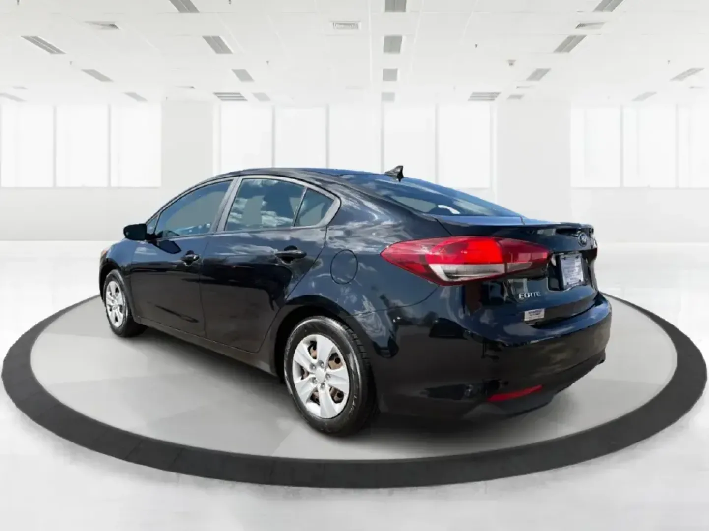 2018 Kia Forte LX (3KPFK4A79JE) with an 2L I-4 DOHC engine, 6M transmission, located at 880 E. National Road, Vandalia, OH, 45377, (937) 908-9800, 39.891918, -84.183594 - Need a dependable commuter that's easy to park downtown, comfortable for I-75 and SR-725 traffic, and still stylish enough for dinner in the Dayton area? This 2018 Kia Forte LX in Aurora Black is a smart, budget-friendly sedan that fits real life in Moraine, OH-whether you're stacking miles for work - Photo#4