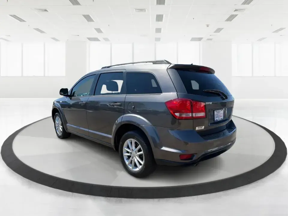 2014 Dodge Journey SXT (3C4PDDBG0ET) with an 3.6L V-6 DOHC engine, 6-Speed Automatic transmission, located at 1099 N County Rd 25A , Troy, OH, 45373, (937) 908-9800, 40.057079, -84.212883 - Pack up the kids, the dog, and the weekend bags-this 2014 Dodge Journey SXT is the kind of SUV that makes everyday life in Troy easier and spontaneous road trips feel completely doable. Whether you're tackling school drop-offs, commuting to Dayton, or planning a family day at the Miami County Fairgr - Photo#4