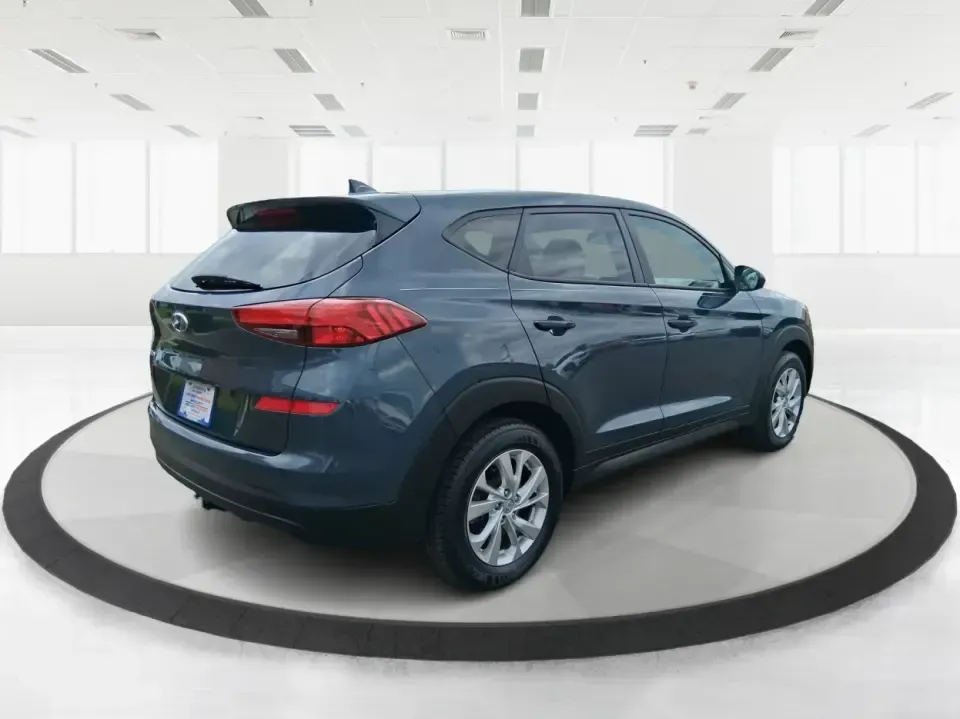 2019 Hyundai Tucson SE (KM8J23A41KU) with an Nu 2L I-4 gasoline direct injection engine, 6A transmission, located at 8750 N County Rd 25A, Piqua, OH, 45356, (937) 908-9800, 40.164391, -84.232513 - Need a practical SUV that can handle the daily school run, a long commute up I75, and weekend trips to the Miami Valley without draining your budget? This 2019 Hyundai Tucson SE in eye-catching Dusk Blue is built for real life in Piqua, Ohio-easy to park, comfortable for passengers, and ready for ev - Photo#2