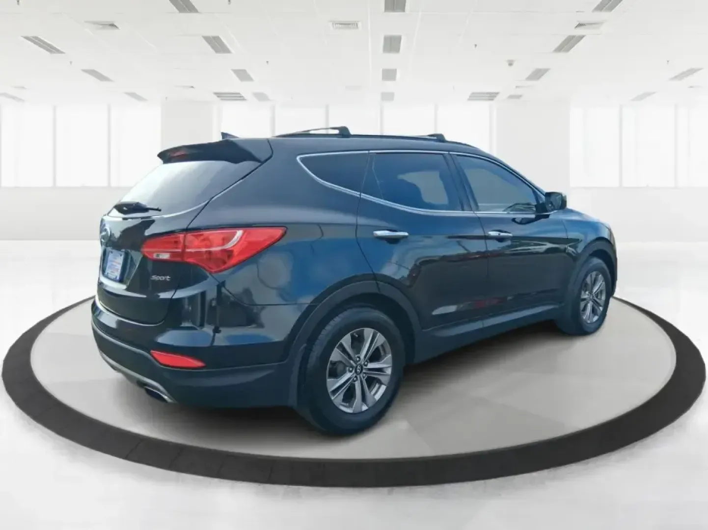 2015 Hyundai Santa Fe Sport 2.4 FWD (5XYZU3LB1FG) with an 2.4L L4 DOHC 16V engine, 6-Speed Automatic transmission, located at 1099 N County Rd 25A , Troy, OH, 45373, (937) 908-9800, 40.057079, -84.212883 - Picture your next road trip out of Troy: the kids buckled in, luggage packed, and plenty of comfort for I75 runs to Dayton or weekend getaways near the Miami River-without feeling like you're stretching your budget. This 2015 Hyundai Santa Fe 2.4L in Twilight Black is the kind of practical, do-it-al- Photo#2