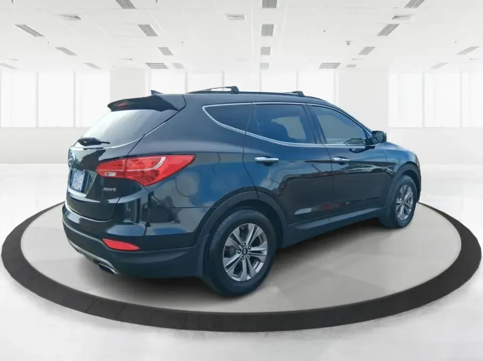 2015 Hyundai Santa Fe 2.4L (5XYZU3LB1FG) with an Theta II 2.4L I-4 gasoline direct injection engine, 6-Speed Automatic transmission, located at 1099 N County Rd 25A , Troy, OH, 45373, (937) 908-9800, 40.057079, -84.212883 - Pack up the kids for a weekend at Treasure Island Park, load the cooler for a day on the Great Miami River, or settle into a comfortable daily commute down I75-this 2015 Hyundai Santa Fe 2.4L is the kind of practical SUV that fits real life in Troy. With confident road manners, flexible cargo space, - Photo#2