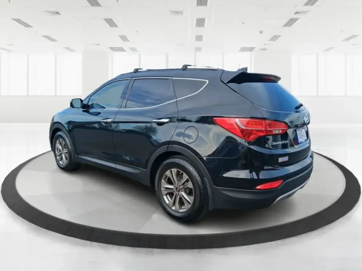2015 Hyundai Santa Fe Sport 2.4 FWD (5XYZU3LB1FG) with an 2.4L L4 DOHC 16V engine, 6-Speed Automatic transmission, located at 1099 N County Rd 25A , Troy, OH, 45373, (937) 908-9800, 40.057079, -84.212883 - Picture your next road trip out of Troy: the kids buckled in, luggage packed, and plenty of comfort for I75 runs to Dayton or weekend getaways near the Miami River-without feeling like you're stretching your budget. This 2015 Hyundai Santa Fe 2.4L in Twilight Black is the kind of practical, do-it-al- Photo#4