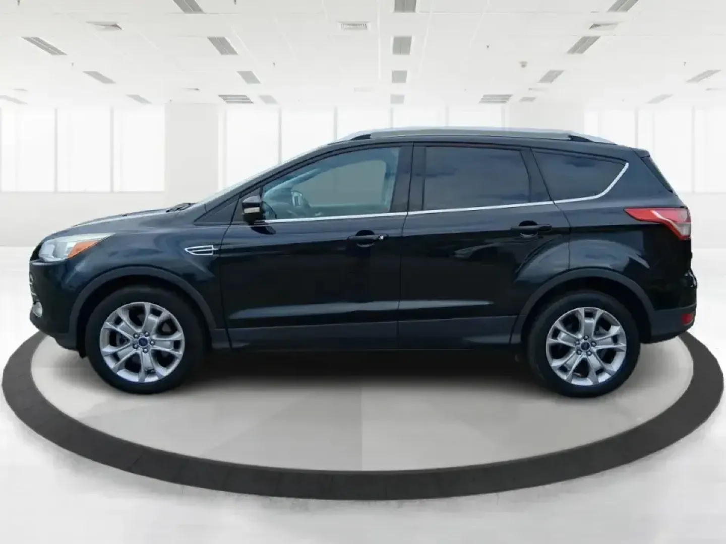 2014 Ford Escape Titanium (1FMCU9J99EU) with an 2.0L L4 DOHC 16V engine, 6-Speed Automatic transmission, located at 1099 N County Rd 25A , Troy, OH, 45373, (937) 908-9800, 40.057079, -84.212883 - Need one SUV that can handle an Ohio winter commute, school drop-offs, and a spontaneous weekend road trip to Hocking Hills without feeling like a compromise? This 2014 Ford Escape Titanium 4WD in sleek Tuxedo Black is built for real life in Troy-comfortable for long drives, confident in bad weather - Photo#5