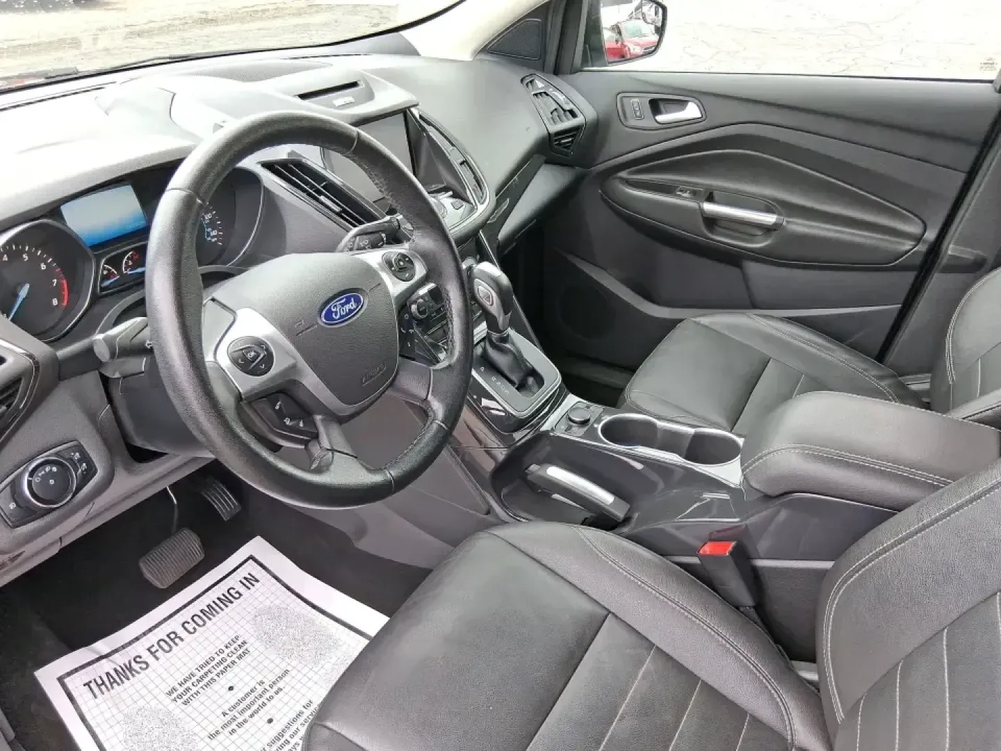2014 Ford Escape Titanium (1FMCU9J99EU) with an 2.0L L4 DOHC 16V engine, 6-Speed Automatic transmission, located at 1099 N County Rd 25A , Troy, OH, 45373, (937) 908-9800, 40.057079, -84.212883 - Need one SUV that can handle an Ohio winter commute, school drop-offs, and a spontaneous weekend road trip to Hocking Hills without feeling like a compromise? This 2014 Ford Escape Titanium 4WD in sleek Tuxedo Black is built for real life in Troy-comfortable for long drives, confident in bad weather - Photo#9
