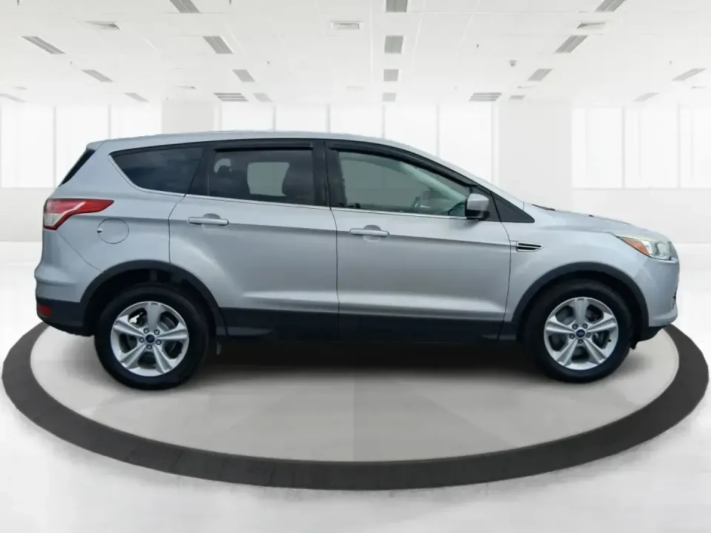 2015 Ford Escape SE (1FMCU9G91FU) with an 2.0L L4 DOHC 16V engine, 6-Speed Automatic transmission, located at 880 E. National Road, Vandalia, OH, 45377, (937) 908-9800, 39.891918, -84.183594 - Weekend getaways to Englewood MetroPark, snowy commutes down I75, and everyday school-and-grocery runs all feel easier when you've got an SUV that's sized right, confident in bad weather, and comfortable for the long haul. This **2015 Ford Escape SE 4WD** in **Ingot Silver** is a smart pick for driv - Photo#1