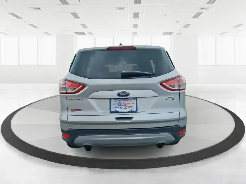 2015 Ford Escape SE (1FMCU9G91FU) with an 2.0L L4 DOHC 16V engine, 6-Speed Automatic transmission, located at 880 E. National Road, Vandalia, OH, 45377, (937) 908-9800, 39.891918, -84.183594 - Weekend getaways to Englewood MetroPark, snowy commutes down I75, and everyday school-and-grocery runs all feel easier when you've got an SUV that's sized right, confident in bad weather, and comfortable for the long haul. This **2015 Ford Escape SE 4WD** in **Ingot Silver** is a smart pick for driv - Photo#3