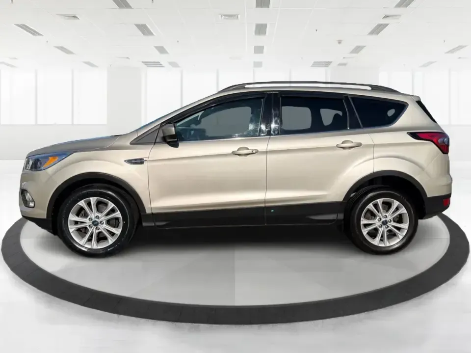 2018 Ford Escape SE FWD (1FMCU0GD6JU) with an 1.5L L4 DOHC 16V engine, 6A transmission, located at 1099 N County Rd 25A , Troy, OH, 45373, (937) 908-9800, 40.057079, -84.212883 - Weekday commute down I75, school drop-offs, and spontaneous weekend getaways to Charleston Falls Preserve all get easier in a compact SUV that fits real life. This 2018 Ford Escape SE FWD is a smart pick for Troy, Ohio drivers who want SUV versatility without the bulk-easy to park near downtown Troy- Photo#5