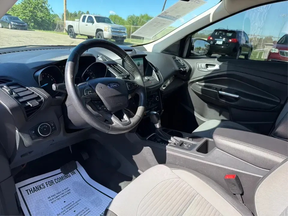 2017 Ford Escape SE (1FMCU0GD2HU) with an 1.5L L4 DOHC 16V engine, 6A transmission, located at 401 Woodman Dr, Riverside, OH, 45431, (937) 908-9800, 39.760899, -84.123421 - Picture a weekday that starts with a smooth commute up N County Rd 25A, turns into easy school drop-offs, and ends with a weekend escape to Indian Lake or a quick run down I75 for shopping and dinner-this 2017 Ford Escape SE is built for real life in and around Piqua, Ohio. Finished in standout Whit - Photo#9