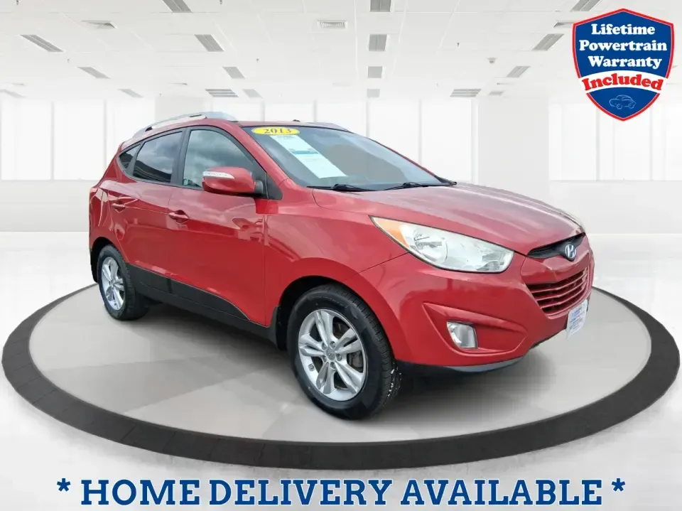 2013 Hyundai Tucson GLS (KM8JUCAC7DU) with an Theta II 2.4L I-4 DOHC engine, 6-Speed Automatic transmission, located at 8750 N County Rd 25A, Piqua, OH, 45356, (937) 908-9800, 40.164391, -84.232513 - Need a dependable SUV that can handle Ohio weather, school drop-offs, and weekend getaways without stretching your budget? This 2013 Hyundai Tucson GLS in eye-catching Garnet Red is built for real life-comfortable for daily commuting, confident on slick winter roads, and practical for everything fro - Photo#0