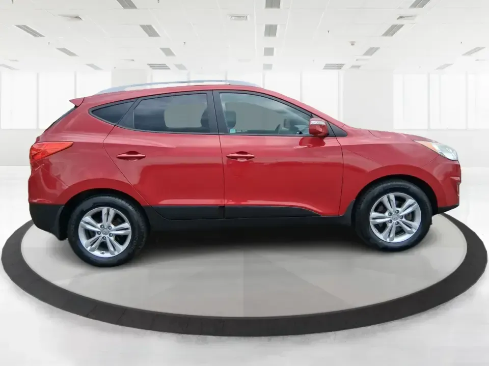 2013 Hyundai Tucson GLS (KM8JUCAC7DU) with an Theta II 2.4L I-4 DOHC engine, 6-Speed Automatic transmission, located at 8750 N County Rd 25A, Piqua, OH, 45356, (937) 908-9800, 40.164391, -84.232513 - Need a dependable SUV that can handle Ohio weather, school drop-offs, and weekend getaways without stretching your budget? This 2013 Hyundai Tucson GLS in eye-catching Garnet Red is built for real life-comfortable for daily commuting, confident on slick winter roads, and practical for everything fro - Photo#1