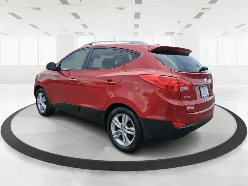 2013 Hyundai Tucson GLS (KM8JUCAC7DU) with an Theta II 2.4L I-4 DOHC engine, 6-Speed Automatic transmission, located at 8750 N County Rd 25A, Piqua, OH, 45356, (937) 908-9800, 40.164391, -84.232513 - Need a dependable SUV that can handle Ohio weather, school drop-offs, and weekend getaways without stretching your budget? This 2013 Hyundai Tucson GLS in eye-catching Garnet Red is built for real life-comfortable for daily commuting, confident on slick winter roads, and practical for everything fro - Photo#4