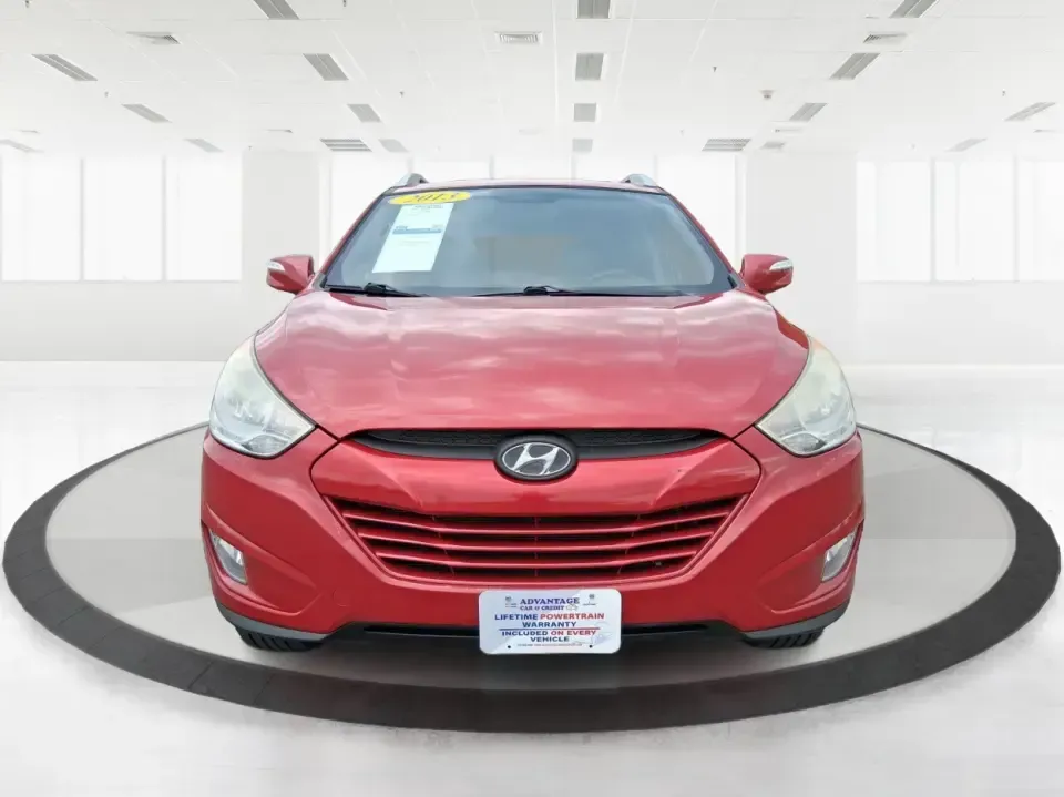 2013 Hyundai Tucson GLS (KM8JUCAC7DU) with an Theta II 2.4L I-4 DOHC engine, 6-Speed Automatic transmission, located at 8750 N County Rd 25A, Piqua, OH, 45356, (937) 908-9800, 40.164391, -84.232513 - Need a dependable SUV that can handle Ohio weather, school drop-offs, and weekend getaways without stretching your budget? This 2013 Hyundai Tucson GLS in eye-catching Garnet Red is built for real life-comfortable for daily commuting, confident on slick winter roads, and practical for everything fro - Photo#7