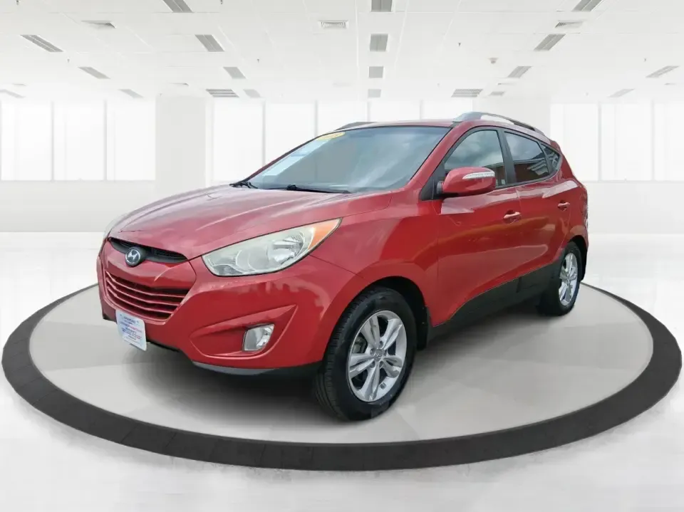 2013 Hyundai Tucson GLS (KM8JUCAC7DU) with an Theta II 2.4L I-4 DOHC engine, 6-Speed Automatic transmission, located at 8750 N County Rd 25A, Piqua, OH, 45356, (937) 908-9800, 40.164391, -84.232513 - Need a dependable SUV that can handle Ohio weather, school drop-offs, and weekend getaways without stretching your budget? This 2013 Hyundai Tucson GLS in eye-catching Garnet Red is built for real life-comfortable for daily commuting, confident on slick winter roads, and practical for everything fro - Photo#8