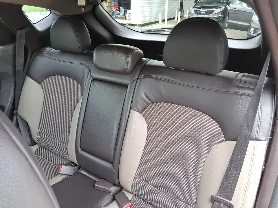 2013 Hyundai Tucson GLS (KM8JUCAC7DU) with an Theta II 2.4L I-4 DOHC engine, 6-Speed Automatic transmission, located at 8750 N County Rd 25A, Piqua, OH, 45356, (937) 908-9800, 40.164391, -84.232513 - Need a dependable SUV that can handle Ohio weather, school drop-offs, and weekend getaways without stretching your budget? This 2013 Hyundai Tucson GLS in eye-catching Garnet Red is built for real life-comfortable for daily commuting, confident on slick winter roads, and practical for everything fro - Photo#10