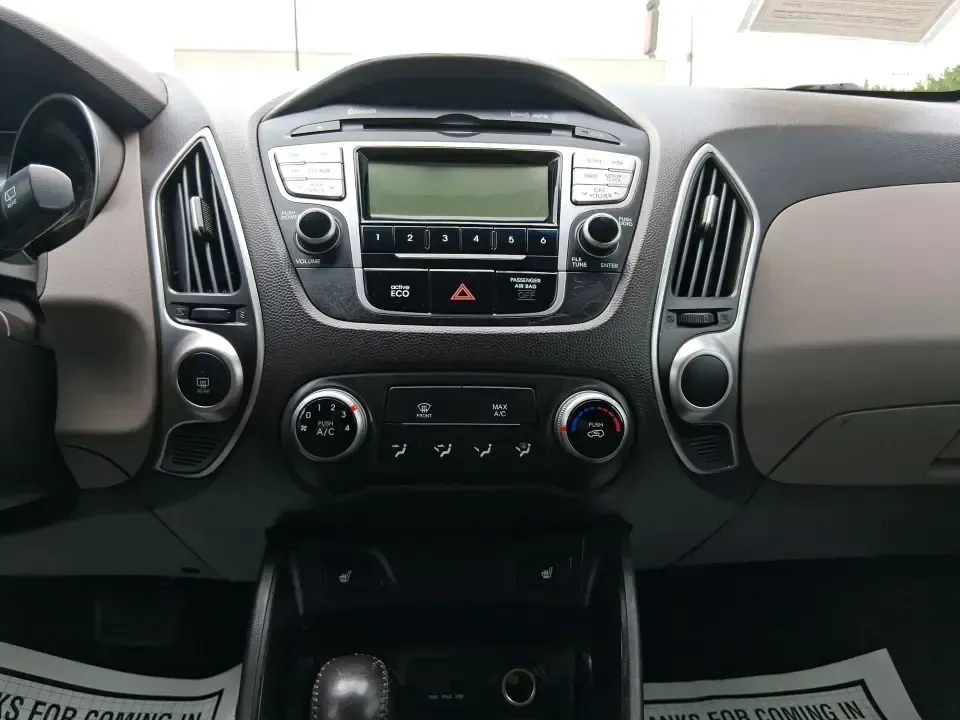 2013 Hyundai Tucson GLS (KM8JUCAC7DU) with an Theta II 2.4L I-4 DOHC engine, 6-Speed Automatic transmission, located at 8750 N County Rd 25A, Piqua, OH, 45356, (937) 908-9800, 40.164391, -84.232513 - Need a dependable SUV that can handle Ohio weather, school drop-offs, and weekend getaways without stretching your budget? This 2013 Hyundai Tucson GLS in eye-catching Garnet Red is built for real life-comfortable for daily commuting, confident on slick winter roads, and practical for everything fro - Photo#13