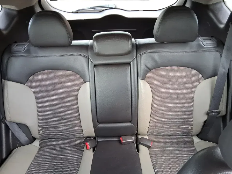 2013 Hyundai Tucson GLS (KM8JUCAC7DU) with an Theta II 2.4L I-4 DOHC engine, 6-Speed Automatic transmission, located at 8750 N County Rd 25A, Piqua, OH, 45356, (937) 908-9800, 40.164391, -84.232513 - Need a dependable SUV that can handle Ohio weather, school drop-offs, and weekend getaways without stretching your budget? This 2013 Hyundai Tucson GLS in eye-catching Garnet Red is built for real life-comfortable for daily commuting, confident on slick winter roads, and practical for everything fro - Photo#14