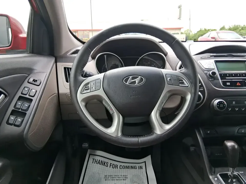 2013 Hyundai Tucson GLS (KM8JUCAC7DU) with an Theta II 2.4L I-4 DOHC engine, 6-Speed Automatic transmission, located at 8750 N County Rd 25A, Piqua, OH, 45356, (937) 908-9800, 40.164391, -84.232513 - Need a dependable SUV that can handle Ohio weather, school drop-offs, and weekend getaways without stretching your budget? This 2013 Hyundai Tucson GLS in eye-catching Garnet Red is built for real life-comfortable for daily commuting, confident on slick winter roads, and practical for everything fro - Photo#16