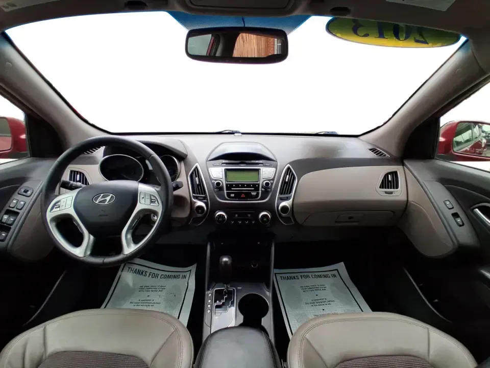 2013 Hyundai Tucson GLS (KM8JUCAC7DU) with an Theta II 2.4L I-4 DOHC engine, 6-Speed Automatic transmission, located at 8750 N County Rd 25A, Piqua, OH, 45356, (937) 908-9800, 40.164391, -84.232513 - Need a dependable SUV that can handle Ohio weather, school drop-offs, and weekend getaways without stretching your budget? This 2013 Hyundai Tucson GLS in eye-catching Garnet Red is built for real life-comfortable for daily commuting, confident on slick winter roads, and practical for everything fro - Photo#19