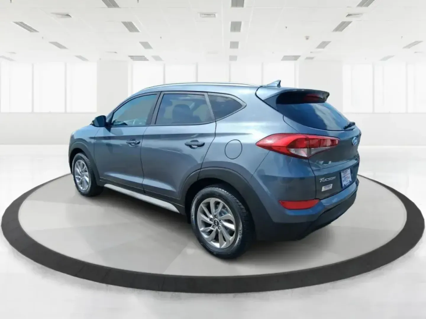 2018 Hyundai Tucson SEL Plus (KM8J33A4XJU) with an Nu 2L I-4 gasoline direct injection engine, 6A transmission, located at 8750 N County Rd 25A, Piqua, OH, 45356, (937) 908-9800, 40.164391, -84.232513 - Need a do-it-all SUV that fits real life in Greene County-school runs, long commutes to Dayton, and weekend getaways to John Bryan State Park-without sacrificing comfort or confidence? This 2018 Hyundai Tucson SEL Plus in Coliseum Gray is built for drivers who want practical space, modern tech, and - Photo#4