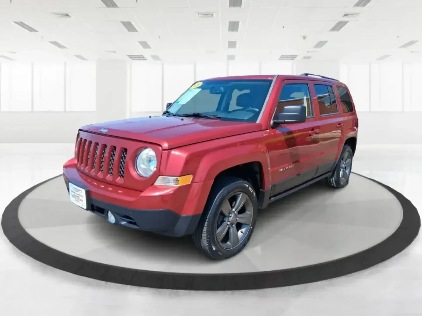 2015 Jeep Patriot Latitude 4WD (1C4NJRFB0FD) with an 2.4L L4 DOHC 16V engine, located at 401 Woodman Dr, Riverside, OH, 45431, (937) 908-9800, 39.760899, -84.123421 - Weekday commuting on I675, weekend runs to Eastwood MetroPark, or a packed-up family road trip toward Yellow Springs-this Deep Cherry Red Crystal Pearlcoat 2015 Jeep Patriot Latitude 4WD is built for the kind of life that doesn't stay parked. With SUV versatility, confident four-wheel drive, and sea- Photo#8
