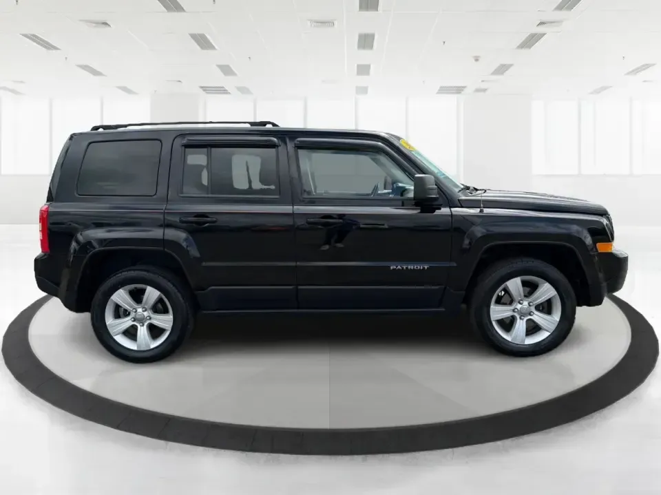 2014 Jeep Patriot Latitude (1C4NJRFB4ED) with an 2.4L I-4 DOHC engine, located at 8750 N County Rd 25A, Piqua, OH, 45356, (937) 908-9800, 40.164391, -84.232513 - Weekend adventures, winter commutes, and everyday errands feel a lot easier when you're in an SUV that's confident on Ohio backroads and comfortable in town. This **2014 Jeep Patriot Latitude 4WD** is a practical, go-anywhere choice for drivers who want Jeep capability without the full-size SUV foot - Photo#1