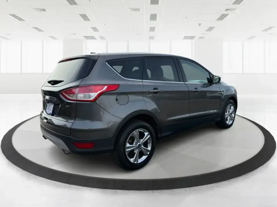 2016 Ford Escape SE (1FMCU0G75GU) with an 2.5L L4 DOHC 16V engine, 6-Speed Automatic transmission, located at 1099 N County Rd 25A , Troy, OH, 45373, (937) 908-9800, 40.057079, -84.212883 - Whether you're juggling school drop-offs, commuting up I75, or planning a weekend run to the Miami County Fairgrounds, this 2016 Ford Escape SE is the kind of practical SUV that fits real-life Troy, Ohio routines. With a versatile cabin, confident road manners, and easy-to-live-with features, it's a - Photo#2