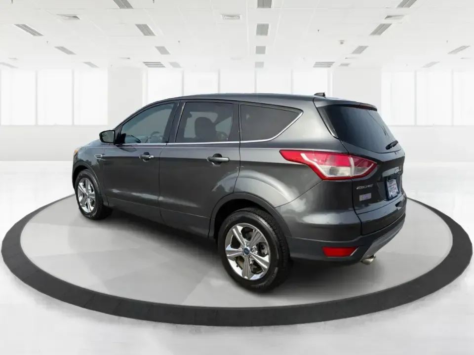 2016 Ford Escape SE (1FMCU0G75GU) with an 2.5L L4 DOHC 16V engine, 6-Speed Automatic transmission, located at 1099 N County Rd 25A , Troy, OH, 45373, (937) 908-9800, 40.057079, -84.212883 - Whether you're juggling school drop-offs, commuting up I75, or planning a weekend run to the Miami County Fairgrounds, this 2016 Ford Escape SE is the kind of practical SUV that fits real-life Troy, Ohio routines. With a versatile cabin, confident road manners, and easy-to-live-with features, it's a - Photo#4