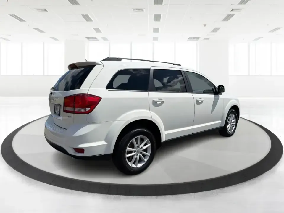 2014 Dodge Journey SXT (3C4PDDBG1ET) with an 3.6L V-6 DOHC engine, 6-Speed Automatic transmission, located at 880 E. National Road, Vandalia, OH, 45377, (937) 908-9800, 39.891918, -84.183594 - Pack up the kids, queue up a playlist, and head out for a weekend getaway-this 2014 Dodge Journey SXT is built for real-life schedules and real-life adventures. Whether you're shuttling to practice, commuting up I-75, or planning a road trip from Vandalia to the National Museum of the U.S. Air Force - Photo#2