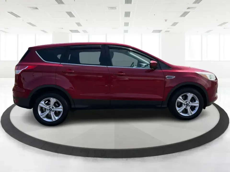 2014 Ford Escape SE (1FMCU9G9XEU) with an 2.0L L4 DOHC 16V engine, 6-Speed Automatic transmission, located at 4508 South Dixie Dr, Moraine, OH, 45439, (937) 908-9800, 39.689976, -84.218452 - Picture your next Ohio weekend: the kids loaded up for a day at Carillon Historical Park, a cooler in back for a picnic at Cox Arboretum, or a quick escape down I75 for a last-minute road trip-without worrying about whether your SUV can handle rain, slush, or a fully packed cargo area. This 2014 For - Photo#1