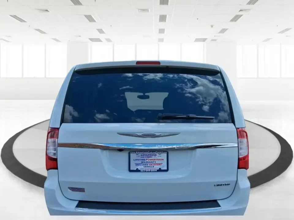 2014 Chrysler Town and Country Limited (2C4RC1GGXER) with an Pentastar 3.6L V-6 DOHC engine, 6-Speed Automatic transmission, located at 4508 South Dixie Dr, Moraine, OH, 45439, (937) 908-9800, 39.689976, -84.218452 - Road-trip ready and family-approved, this 2014 Chrysler Town and Country Limited is the kind of minivan that fits real life in Moraine-school drop-offs, grocery runs, weekend tournaments, and those longer drives up I-75 or across town toward Dayton. Finished in Bright White Clearcoat, it blends a - Photo#2