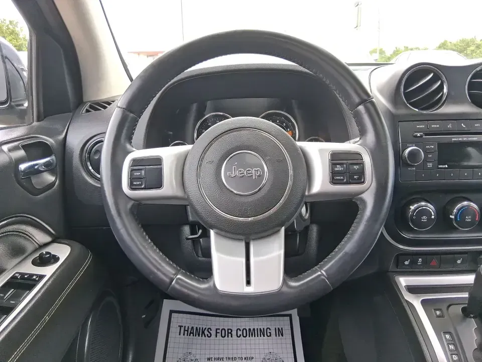 2017 Jeep Compass High Altitude FWD (1C4NJCEBXHD) with an 2.4L L4 DOHC 16V engine, CVT transmission, located at 1951 S Dayton Lakeview Rd., New Carlisle, OH, 45344, (937) 908-9800, 39.890999, -84.050255 - Picture your next week looking simpler: a comfortable SUV for the daily commute down I70, school drop-offs, and spontaneous Saturday drives to Buck Creek State Park-without feeling like you have to put your life on hold while you shop for financing. This 2017 Jeep Compass High Altitude FWD in Black - Photo#16