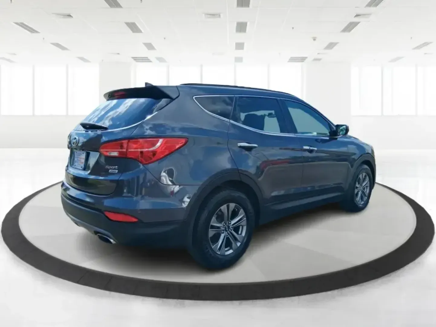 2015 Hyundai Santa Fe 2.4L (5XYZUDLB3FG) with an Theta II 2.4L I-4 gasoline direct injection engine, 6-Speed Automatic transmission, located at 1230 East Main St, Xenia, OH, 45385, (937) 908-9800, 39.688026, -83.910172 - Pack up the kids, load the cooler, and point your weekend plans toward the open road-this 2015 Hyundai Santa Fe 2.4L in Platinum Graphite is the kind of SUV that fits real life in Riverside. Whether you're commuting down I-75, running errands along Woodman Dr, or heading out for a day at Eastwood Me - Photo#2
