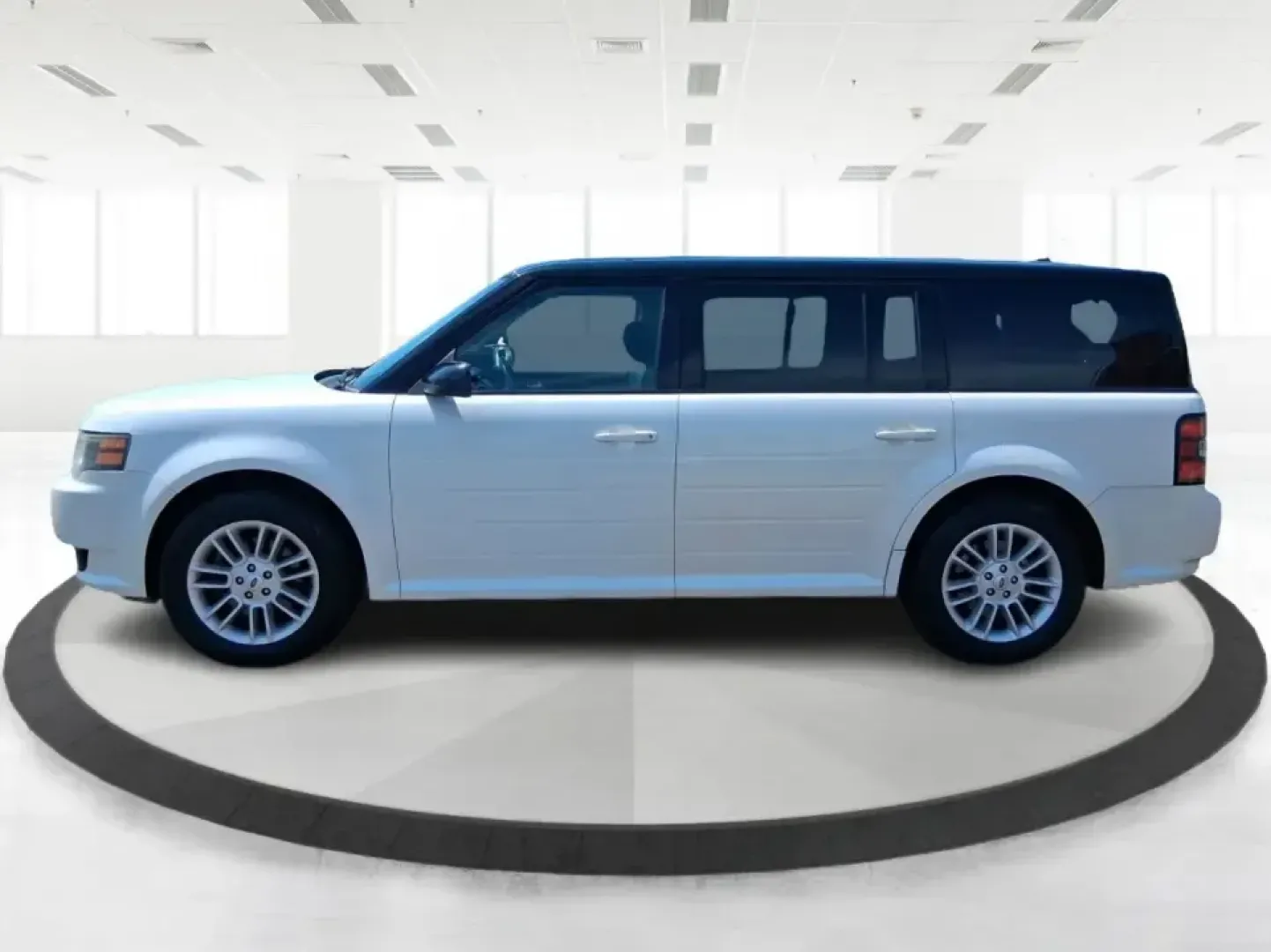 2011 Ford Flex Titanium (2FMGK5DC2BB) with an Duratec 3.5L V-6 DOHC engine, 6-Speed Automatic Overdrive transmission, located at 1951 S Dayton Lakeview Rd., New Carlisle, OH, 45344, (937) 908-9800, 39.890999, -84.050255 - Road-trip ready and family-friendly without feeling like a bus, this 2011 Ford Flex Limited | Titanium is the kind of crossover that fits real life-school drop-offs, long commutes, weekend tournaments, and those last-minute runs for groceries when the cargo space actually matters. Finished in White- Photo#5