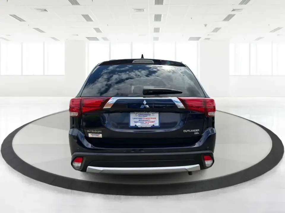 2018 Mitsubishi Outlander SEL (JA4AD3A39JJ) with an 2.4L I-4 variable valve control engine, CVT transmission, located at 1230 East Main St, Xenia, OH, 45385, (937) 908-9800, 39.688026, -83.910172 - Weekend road trips to John Bryan State Park, daily commutes down US-35, or school-drop runs around Xenia's neighborhoods-this 2018 Mitsubishi Outlander SEL is the kind of SUV that fits real life. Finished in eye-catching Cosmic Blue Metallic and built with three-row flexibility, it's a smart pick fo - Photo#3