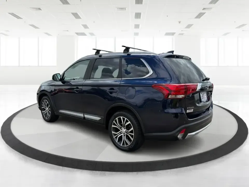 2018 Mitsubishi Outlander SEL (JA4AD3A39JJ) with an 2.4L I-4 variable valve control engine, CVT transmission, located at 4508 South Dixie Dr, Moraine, OH, 45439, (937) 908-9800, 39.689976, -84.218452 - Weekend road trips to John Bryan State Park, daily commutes down US-35, or school-drop runs around Xenia's neighborhoods-this 2018 Mitsubishi Outlander SEL is the kind of SUV that fits real life. Finished in eye-catching Cosmic Blue Metallic and built with three-row flexibility, it's a smart pick fo - Photo#4