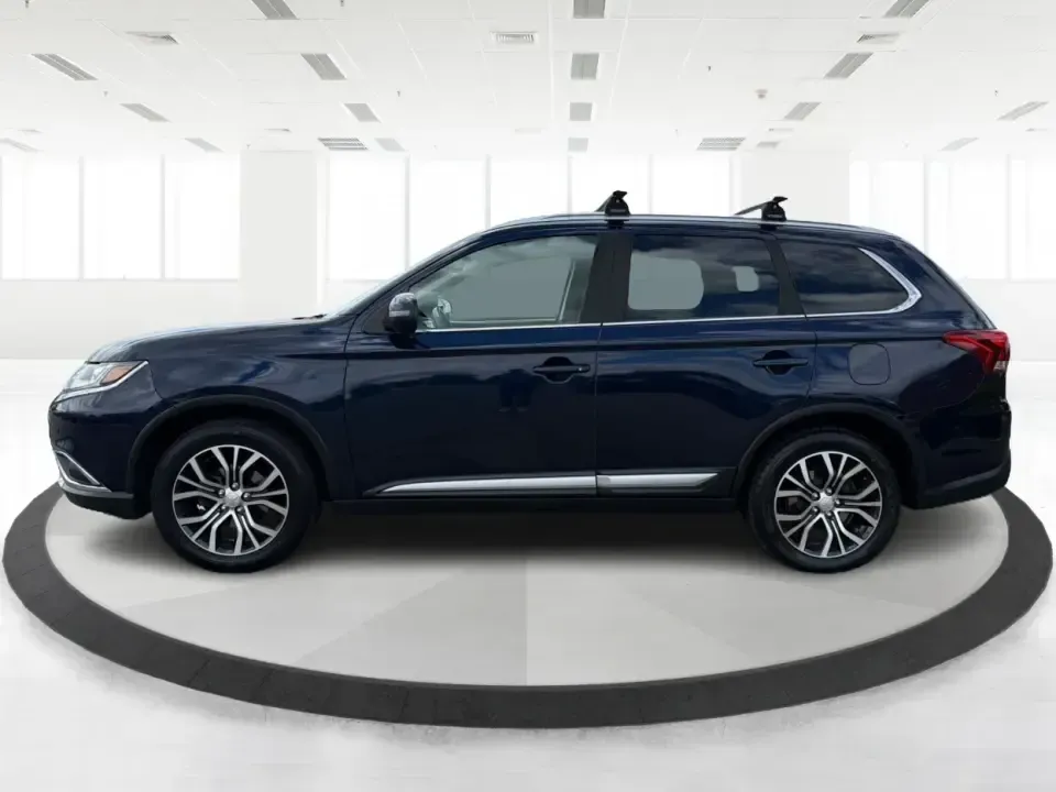 2018 Mitsubishi Outlander SEL (JA4AD3A39JJ) with an 2.4L I-4 variable valve control engine, CVT transmission, located at 4508 South Dixie Dr, Moraine, OH, 45439, (937) 908-9800, 39.689976, -84.218452 - Weekend road trips to John Bryan State Park, daily commutes down US-35, or school-drop runs around Xenia's neighborhoods-this 2018 Mitsubishi Outlander SEL is the kind of SUV that fits real life. Finished in eye-catching Cosmic Blue Metallic and built with three-row flexibility, it's a smart pick fo - Photo#5