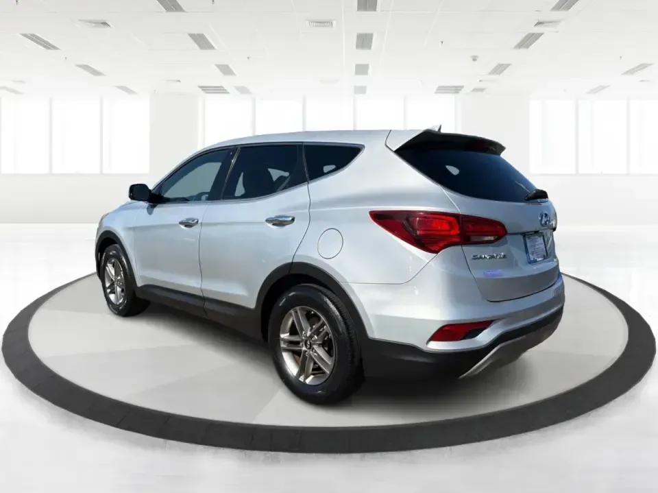 2017 Hyundai Santa Fe 2.4L (5XYZT3LB8HG) with an Theta II 2.4L I-4 gasoline direct injection engine, 6A transmission, located at 8750 N County Rd 25A, Piqua, OH, 45356, (937) 908-9800, 40.164391, -84.232513 - Load up the family, point the GPS toward a weekend getaway, and enjoy the confidence of an SUV that's built for everyday life in Ohio-this **2017 Hyundai Santa Fe 2.4L** is a smart pick for commuting, school runs, and road trips alike. Finished in **Sparkling Silver**, it brings the practical space - Photo#4
