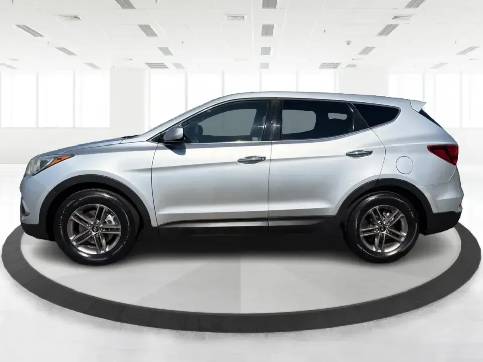 2017 Hyundai Santa Fe 2.4L (5XYZT3LB8HG) with an Theta II 2.4L I-4 gasoline direct injection engine, 6A transmission, located at 8750 N County Rd 25A, Piqua, OH, 45356, (937) 908-9800, 40.164391, -84.232513 - Load up the family, point the GPS toward a weekend getaway, and enjoy the confidence of an SUV that's built for everyday life in Ohio-this **2017 Hyundai Santa Fe 2.4L** is a smart pick for commuting, school runs, and road trips alike. Finished in **Sparkling Silver**, it brings the practical space - Photo#5