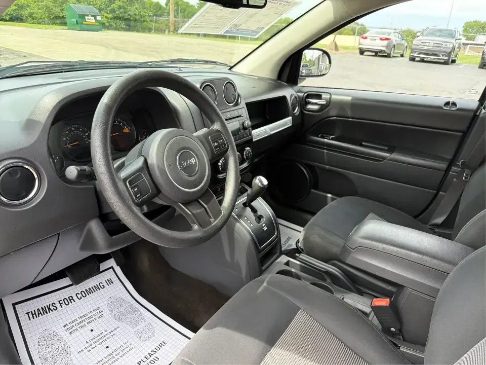 2016 Jeep Compass Sport (1C4NJCBA1GD) with an 2.0L L4 DOHC 16V engine, Automatic transmission, located at 4508 South Dixie Dr, Moraine, OH, 45439, (937) 908-9800, 39.689976, -84.218452 - **Adventure Awaits with the 2016 Jeep Compass Sport in Fairborn, OH!**<br /> <br /> Are you and your family ready to embark on thrilling weekend adventures or find the ideal companion for your daily commute? Look no further! The 2016 Jeep Compass Sport is the perfect SUV for those who need a dependa - Photo#9