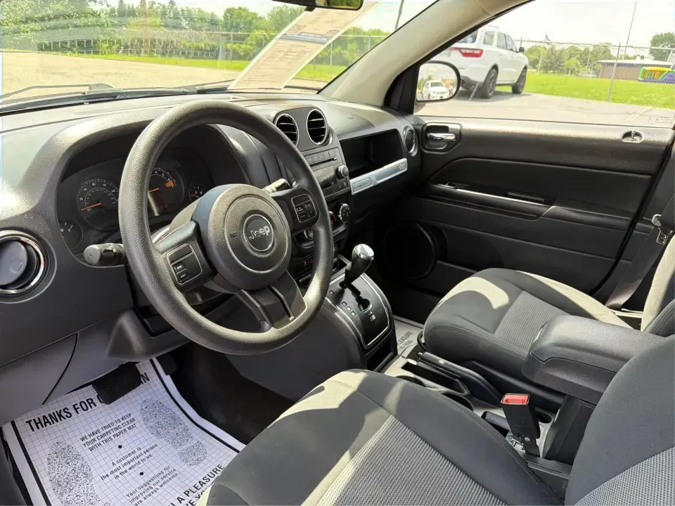 2015 Jeep Compass Sport (1C4NJDBB8FD) with an 2.4L I-4 DOHC engine, located at 401 Woodman Dr, Riverside, OH, 45431, (937) 908-9800, 39.760899, -84.123421 - Weekend plans don't always stay on pavement-and that's exactly where this 2015 Jeep Compass Sport shines. Whether you're mapping out a family day at Riverscape MetroPark, heading to Wright-Patterson AFB for work, or taking a quick escape to the trails and backroads outside Riverside, this compact SU - Photo#9