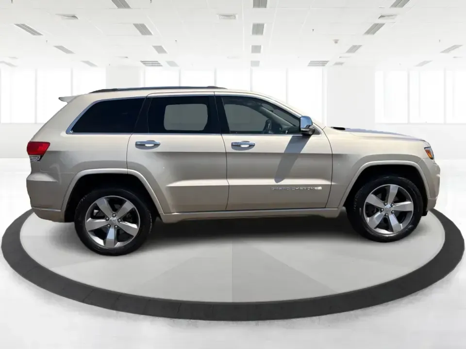 2014 Jeep Grand Cherokee Overland (1C4RJFCTXEC) with an 5.7L V8 OHV 16V engine, 5-Speed Automatic transmission, located at 8750 N County Rd 25A, Piqua, OH, 45356, (937) 908-9800, 40.164391, -84.232513 - Picture your next weekend: loading up for a road trip to Yellow Springs, cruising I675 with the family in comfort, or heading out to the trails and backroads around Wright-Patterson Air Force Base with the confidence of 4WD. This 2014 Jeep Grand Cherokee Overland is built for drivers who want a refi - Photo#1