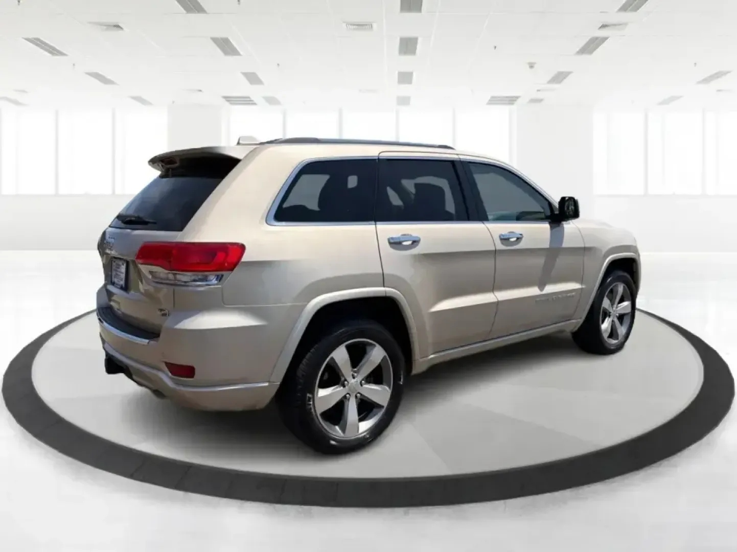 2014 Jeep Grand Cherokee Overland (1C4RJFCTXEC) with an 5.7L V8 OHV 16V engine, 5-Speed Automatic transmission, located at 1951 S Dayton Lakeview Rd., New Carlisle, OH, 45344, (937) 908-9800, 39.890999, -84.050255 - Picture your next weekend: loading up for a road trip to Yellow Springs, cruising I675 with the family in comfort, or heading out to the trails and backroads around Wright-Patterson Air Force Base with the confidence of 4WD. This 2014 Jeep Grand Cherokee Overland is built for drivers who want a refi - Photo#2
