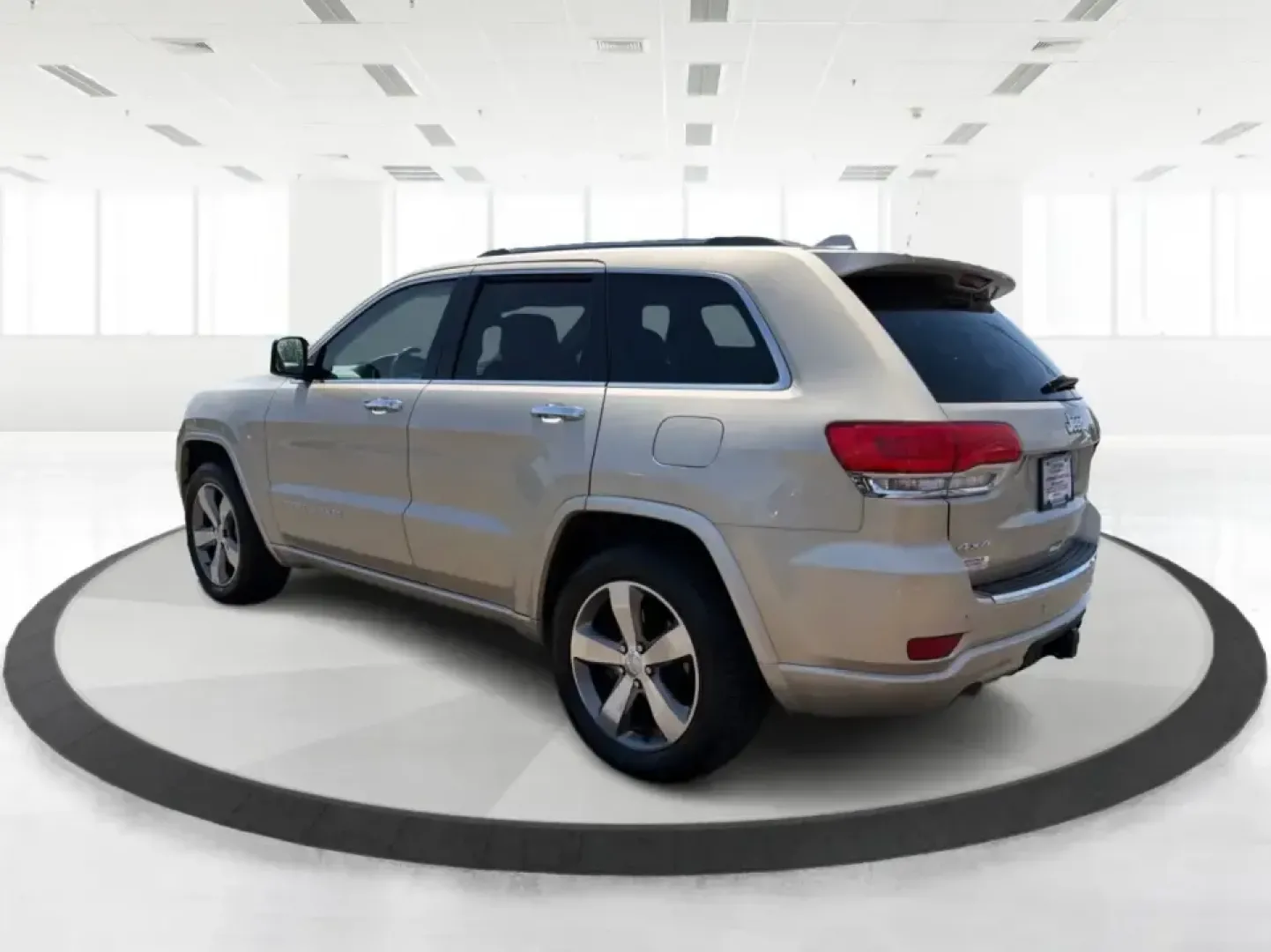 2014 Jeep Grand Cherokee Overland (1C4RJFCTXEC) with an 5.7L V8 OHV 16V engine, 5-Speed Automatic transmission, located at 1951 S Dayton Lakeview Rd., New Carlisle, OH, 45344, (937) 908-9800, 39.890999, -84.050255 - Picture your next weekend: loading up for a road trip to Yellow Springs, cruising I675 with the family in comfort, or heading out to the trails and backroads around Wright-Patterson Air Force Base with the confidence of 4WD. This 2014 Jeep Grand Cherokee Overland is built for drivers who want a refi - Photo#4
