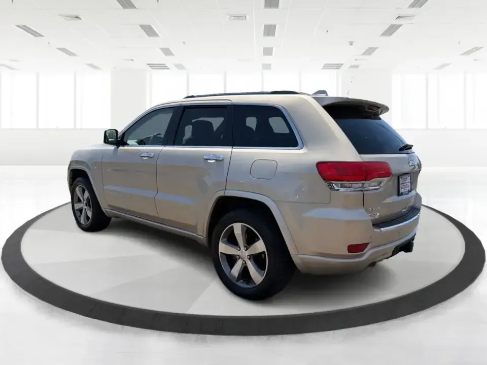 2014 Jeep Grand Cherokee Overland (1C4RJFCTXEC) with an 5.7L V8 OHV 16V engine, 5-Speed Automatic transmission, located at 8750 N County Rd 25A, Piqua, OH, 45356, (937) 908-9800, 40.164391, -84.232513 - Picture your next weekend: loading up for a road trip to Yellow Springs, cruising I675 with the family in comfort, or heading out to the trails and backroads around Wright-Patterson Air Force Base with the confidence of 4WD. This 2014 Jeep Grand Cherokee Overland is built for drivers who want a refi - Photo#4