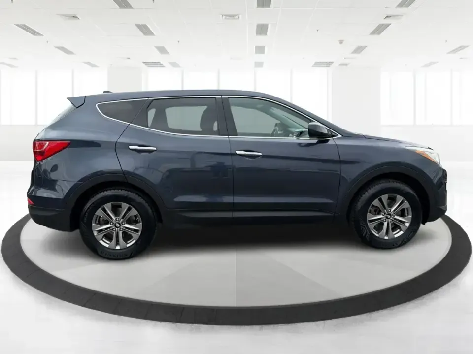 2015 Hyundai Santa Fe 2.4L (5XYZTDLB6FG) with an Theta II 2.4L I-4 gasoline direct injection engine, 6-Speed Automatic transmission, located at 401 Woodman Dr, Riverside, OH, 45431, (937) 908-9800, 39.760899, -84.123421 - Need one SUV that can handle school drop-offs, weekday commutes, and the occasional weekend escape to Eastwood MetroPark or a day trip down I-75? This 2015 Hyundai Santa Fe 2.4L in Mineral Gray fits that real-life rhythm with confident SUV versatility, family-friendly space, and comfort features tha - Photo#1