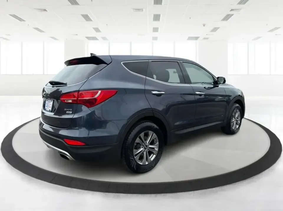 2015 Hyundai Santa Fe 2.4L (5XYZTDLB6FG) with an Theta II 2.4L I-4 gasoline direct injection engine, 6-Speed Automatic transmission, located at 401 Woodman Dr, Riverside, OH, 45431, (937) 908-9800, 39.760899, -84.123421 - Need one SUV that can handle school drop-offs, weekday commutes, and the occasional weekend escape to Eastwood MetroPark or a day trip down I-75? This 2015 Hyundai Santa Fe 2.4L in Mineral Gray fits that real-life rhythm with confident SUV versatility, family-friendly space, and comfort features tha - Photo#2