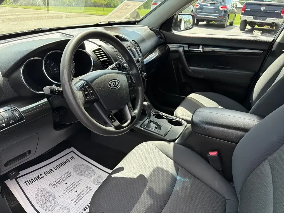 2013 Kia Sorento LX 2WD (5XYKT3A69DG) with an 2.4L L4 DOHC 16V engine, 6-Speed Automatic transmission, located at 8750 N County Rd 25A, Piqua, OH, 45356, (937) 908-9800, 40.164391, -84.232513 - Pack up the kids, load the cooler, and point your weekend plans toward Indian Lake or a quick getaway down I-75-this 2013 Kia Sorento LX 2WD is the kind of practical SUV that fits real life in Piqua. With roomy seating, flexible cargo space, and everyday comfort, it's a smart pick for growing famili - Photo#9